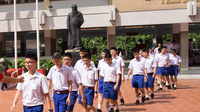 Boy's uniform of Assumption College (Thailand) with dark blue shorts