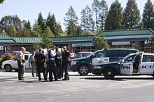 Municipal police officers, county sheriff's deputies, and state highway patrol officers at the scene of a pursuit termination in Scotts Valley, California 2009-04-06 Scotts Valley Chase 07.jpg