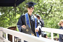 Academic regalia consisting of mortarboard cap, tassell, gown, and academic honors stole (Whitman College) Academic Regalia.jpg