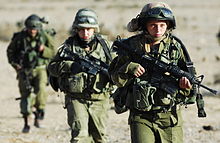 Three armed female soldiers
