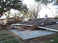 Brick house completely destroyed with nearby double wide house severely damaged from Hurricane Ike