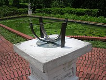 Bowstring sundial in Singapore Botanic Gardens. The design shows that Singapore is located almost at the equator. Sundial, Singapore Botanic Gardens.jpg