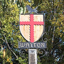 Walton Village Sign - The sign was given to the village by 'Walton carnival Funtime' in June 1993. The sign is based upon the coat of arms and crest of the 1st Earl of Norfolk, Roger Bigod who was granted the Manor of Walton in 1066 by William the Conqueror. The sign is positioned next to the church. Walton Village Sign.jpg