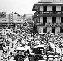 Busy activity in Glodok chinatown, Jakarta, 1953. Restrictions on rural non-indigenous retail businesses in 1959 led to rapid urbanization of the ethnic Chinese community. COLLECTIE TROPENMUSEUM Glodok wijk te Djakarta TMnr 10014951.jpg