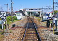 View of the station from the south before the removal of the platform 1 track on the left, with the Tōbu Ogose Line platforms on the right, April 2011