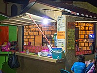 Pupusía ing Santiago Texacuangos, El Salvador. Elinga macem-macem pupus sing diiklanake ing tembok: pitik, jalapeño, chipilín, lan alpukat