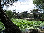Several Chinese style pavilions near a lotus pond.
