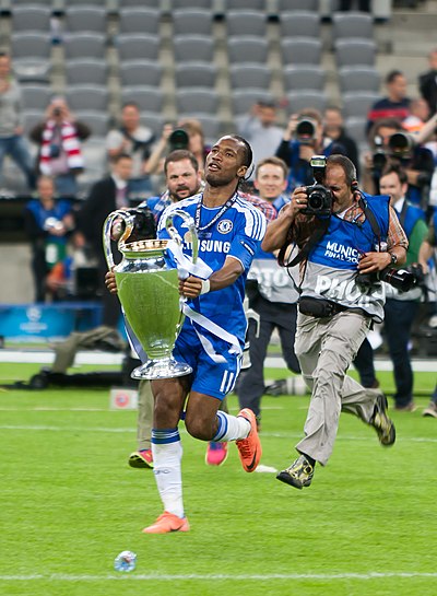 Drogba holding the European Cup following Chelsea's penalty shootout victory over Bayern Munich