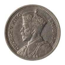 A coin featuring a crowned bust of King George V.