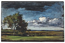 This pastoral landscape is composed in bands of colour: green grass, golden fields, and a sliver of blue ocean in the distance. Two small trees grow in the middle ground. A band of clouds sits close to the horizon in the deep blue sky.