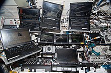 An array of ISS laptops in the US lab (2013) ISS-38 EVA-1 Laptops.jpg