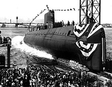 The launching ceremony of the USS Nautilus January 1954. In 1958 it would become the first vessel to reach the North Pole. Nautiluscore.jpg