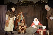 A moment from The Second Shepherds' Play in the Wakefield Mystery Plays as performed by The Players of St Peter in London in 2005. Second Shepherds Play 01620035.jpg