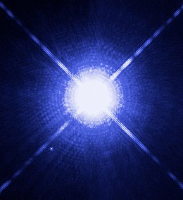 The well-known binary star Sirius, seen here in a Hubble photograph from 2005, with Sirius A in the center, and white dwarf, Sirius B, to the left bottom from it Sirius A and B Hubble photo.jpg