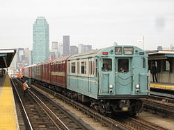 The Train of Many Colors running in service on the 7 train bypassing 40th Street-Lowery Street station, with R33S 9306 leading. Train of Many Colors 4 8 08 at 40 Lowery.jpg