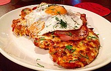 A Chicken parmigiana, based on a combination of the Italian parmigiana di melanzane
with a cotoletta
. It is widespread in North America and Australia. Aussie Parma (cropped).jpg