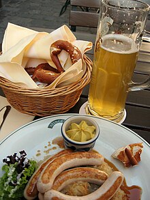 Bavarian Bratwurst with mustard, a pretzel, and German beer BavarianLunch.jpg