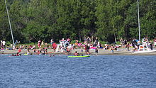 An early summer day at Jewel Lake Park in western Anchorage, Alaska Beach at Jewel Lake Park, Anchorage, Alaska.jpg