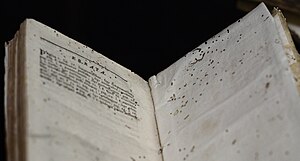 A book showing damage from insect infestation ...