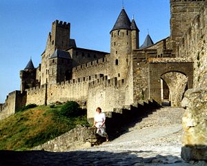 Cité de Carcassonne, woman on wall