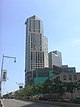 City Point Tower II, a high-rise clad in light-toned stone and dark-toned glass in irregular patterns, viewed from street level