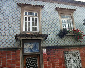 Azulejo façade in Bairro Sul with door panel.