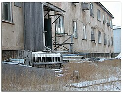 Abandoned apartment block and piano in Leningradsky