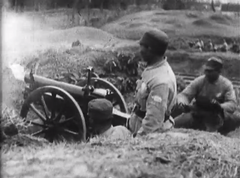 NRA troops firing artillery at Communist forces