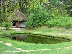 19th-century bathhouse in The Ethnographic Open-Air Museum of Latvia. As bathhouses traditionally were used for birthing, related rituals honoring Laima also were carried out there Old Latvian bathhouse with a pond.jpg