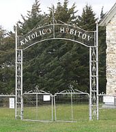 Metal gate inscribed "Katolicky Hrbitov"