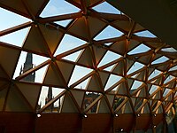 The roof of the Museum's covered court, with the old Coventry Cathedral visible in the background.