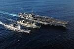 HMAS Success performing a double underway replenishment of US Ships Kitty Hawk and Cowpens in 2005