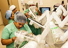 Medical personnel place sterilized covers on the arms of the daVinci Xi surgical system, a minimally-invasive robotic surgery system, at the William Beaumont Army Medical Center. WBAMC first in DoD to use robot for surgery 160426-A-EK666-511.jpg