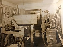 Enlisted men of the 1st Separate Battalion, an all African-American unit, examining weapons in the old army arms room prior to World War I Arms room.jpg