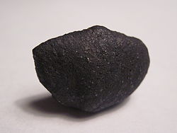 Chergach meteorite collected at Erg Chech; crusted individual, 5.7 gram.