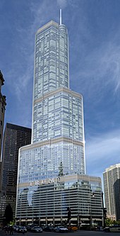 Full exterior view of Trump International Hotel and Tower in Chicago, a contemporary skyscraper with a glass curtain and the word "Trump" written in larger lettering on the side
