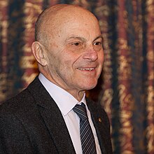 Nobel laureate Gene Fama is often called the "father of modern finance" for his contributions to the study of finance. Eugene Fama at Nobel Prize, 2013.jpg