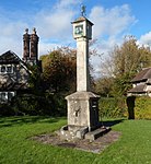 Sundial to the middle of the green at Blaise Hamlet