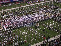A group of high school marching bands performs at the halftime show of the 2006 Chick-fil-A Bowl. Marching band halftime 2006 CFA Bowl.jpg