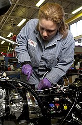 Mechanic working on a motorcycle, United States Mechanic at work seattle.jpg