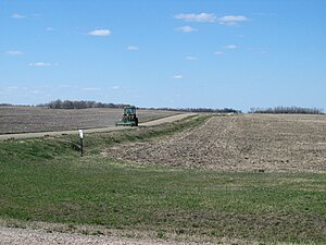 Tractor and fields of I-94, North Dakota, USA.