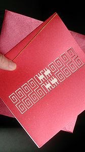 Chinese wedding invitation card with a double happiness character in the center