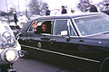 Richard Nixon waves in presidential limousine.jpg