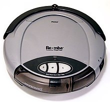 First generation Roomba vacuums the carpets in a domestic environment. Roomba original.jpg