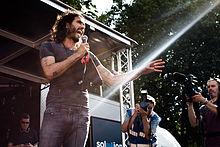 Brand speaking at the People's Assembly Against Austerity rally in London, June 2014 Russell Brand London Revolution Protest.jpg