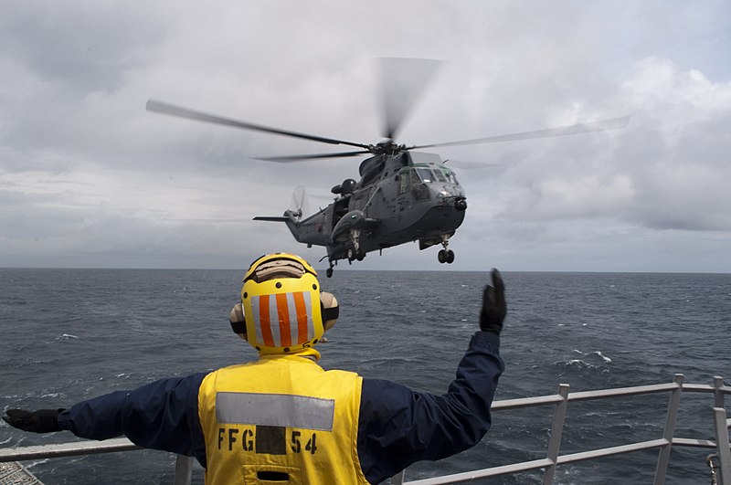File:U.S. Navy Boatswain's Mate 3rd Class Wesley Malcher guides a Royal Canadian Navy CH-124 Sea King helicopter for landing on the guided missile frigate USS Ford (FFG 54) during Exercise Trident Fury 2013 130513-N-QY316-028.jpg