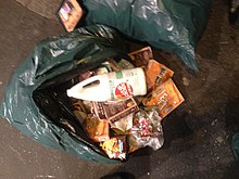 Bleach on discarded food in Paris, France Bleach on food waste.jpg