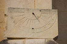 Antique sundial with clumsily engraved numerals