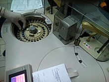 A clinical chemistry analyzer; hand shows size Clinical Chemistry Analyzer , Klinichki biokhemiski analizator 3.jpg