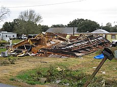 A pile of wood and metal framing, the remains of a mobile home that was destroyed by a tornado